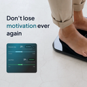 Person standing on a smart body composition scale with app interface showing metabolic age and lean mass metrics, alongside text ‘Don’t lose motivation ever again’.
